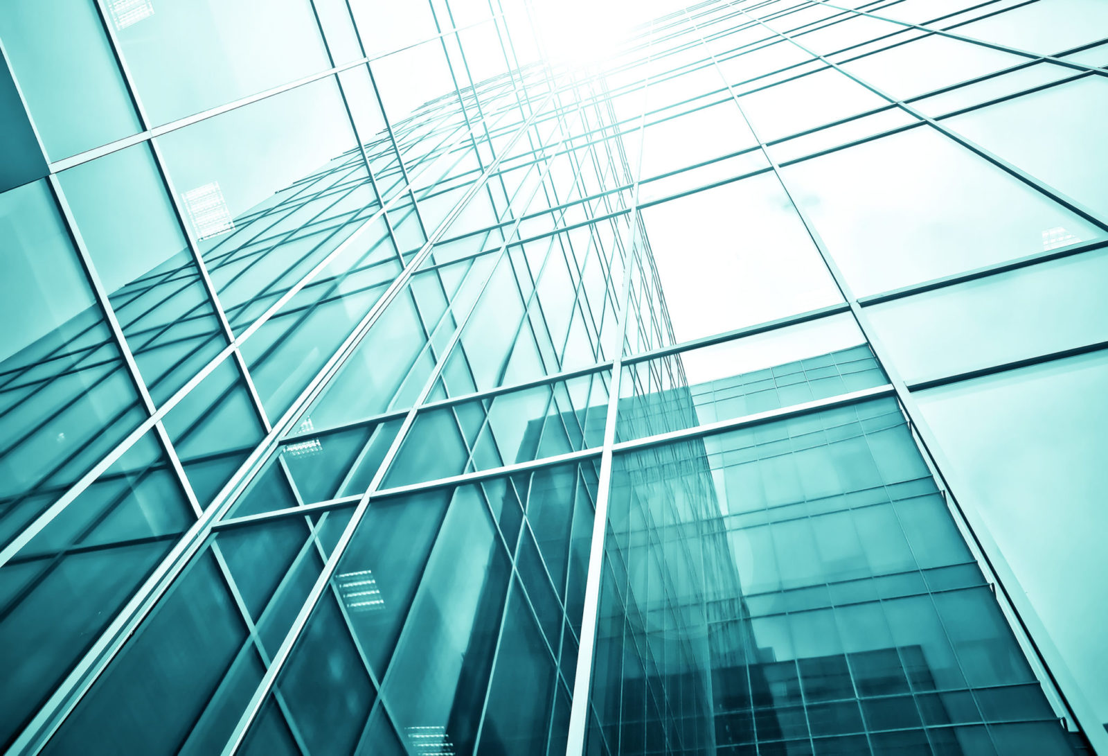 wide angle view to steel blue background of glass high building